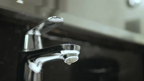 Turn off stop the leaking tap water from the faucet in toilet. Save water sav Stock-Footage 203722866