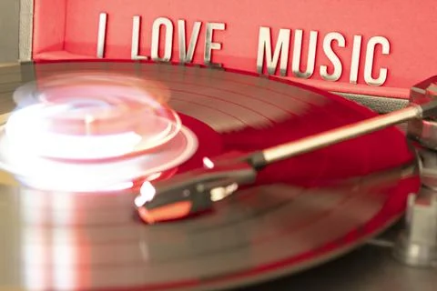 Turn table needle playing a LP vinyl disc with turn table and I love music Stock Photos