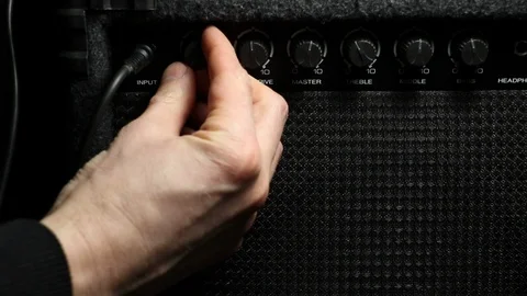 Turn up the volume. plugging in mic into amplifier Video stock 85870587