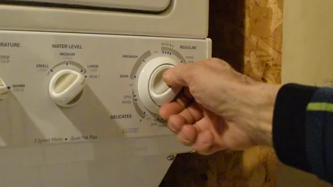 Turn washing machine on Stock Footage 169562641