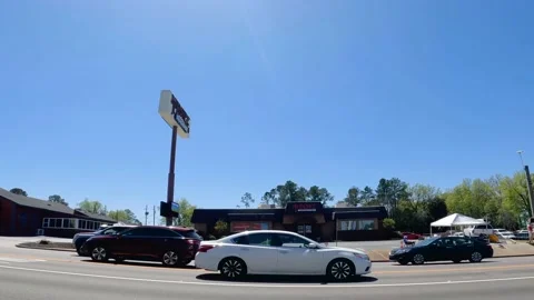 Turn on to Washington Road and Masters golf tournament ticket scalper tents t Stock Footage 174735970