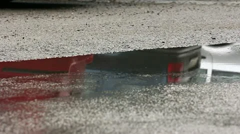 Turned car in a water puddle Stock Footage 11880547