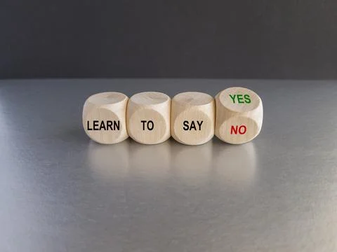 Turned a cube and changes the expression learn to say yes to learn to say no. Stock Photos