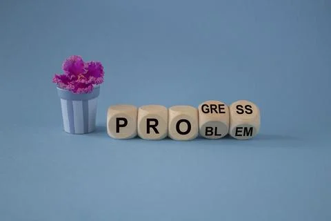 Turned a cube and changes the word problem to progress. Stock Photos