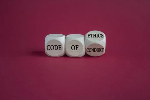 Turned a cube and changes the words 'code of conduct' and 'code of ethics'. Stock-Fotos
