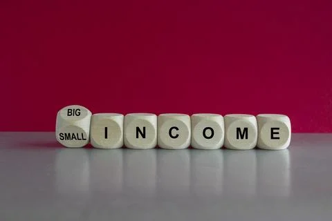 Turned a cube and changes words Small income to Big income. Stock Photos