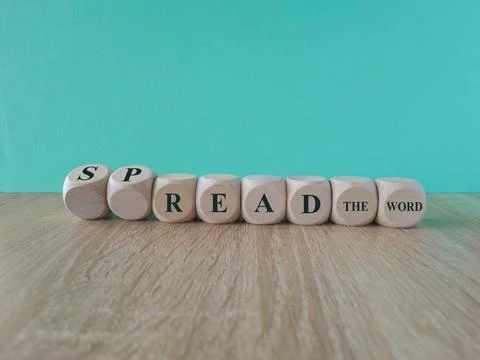 Turned cubes and changed the words spread the word and read the word. Stock Photos