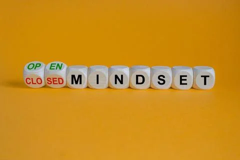 Turned  cubes and changes concept red words closed mindset to open mindset Stock Photos