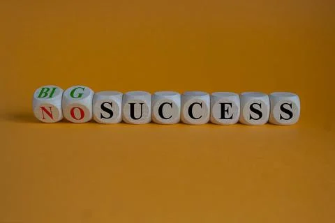 Turned cubes and changes the expression no success to big success. Stock Photos