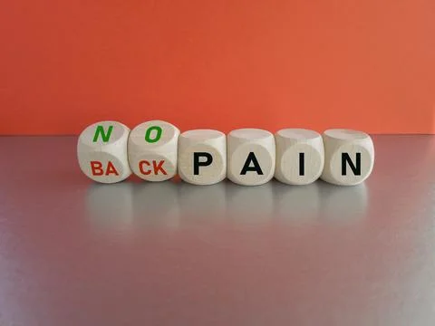 Turned the cubes and changes the expression 'back pain' to 'no pain'. Foto stock