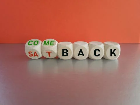 Turned cubes and changes the expression 'setback' to 'comeback'. Stock Photos