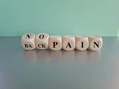 Turned cubes and changes the expression 'back pain' to 'no pain'. Foto stock