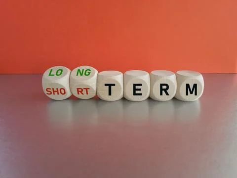 Turned the cubes and changes the expression SHORT TERM to LONG TERM Stock Photos