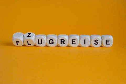 Turned cubes and changes the German word Flugreise  to Zugreise Stock Photos