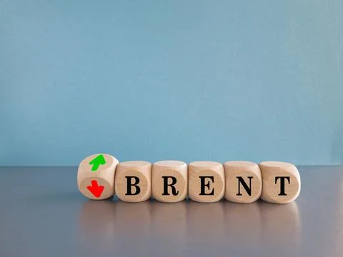 Turned dice and changes the up and down arrow next to the word Brent. 写真素材