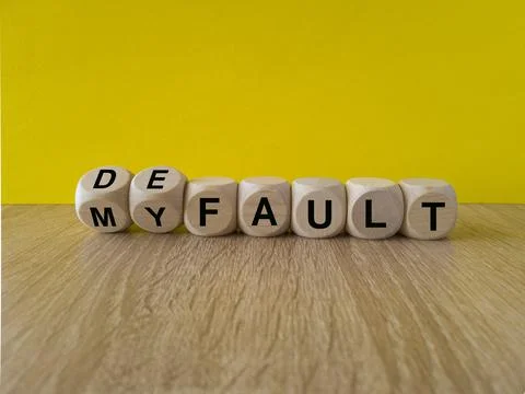 Turned dice and changes the expression my fault to default. Stock Photos