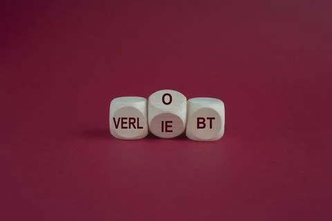 Turned a dice and changes the expression verliebt to verlobt Stock Photos