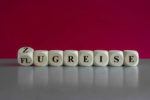 Turned dice and changes the German word Flugreise  to Zugreise Stock Photos