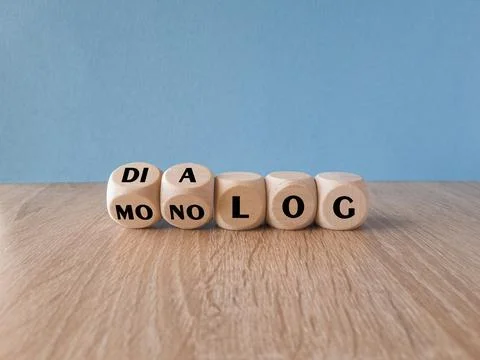 Turned a dice and changes the German word Monolog  to Dialog Stock Photos