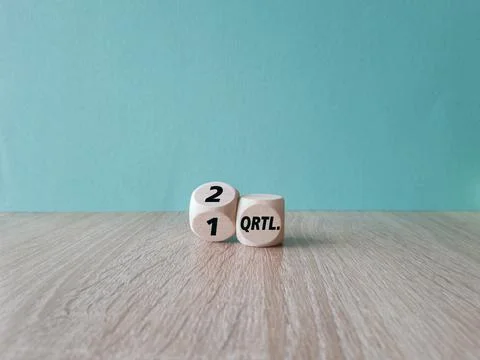 Turned a dice and changes the German expression '1 Qrtl'  to 2 Qrtl Stock Photos
