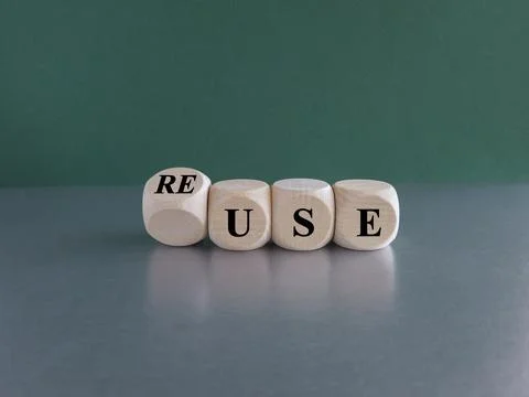 Turned a dice and changes the word use to reuse. Stock Photos