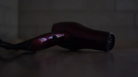The turned-on hair dryer is lying Stock Footage 325436244