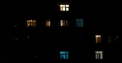Turned on light in the windows of the building Stock Photos