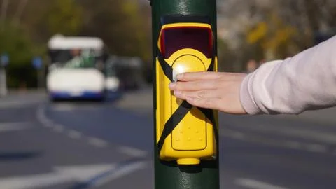 Turned off traffic light button for crossing the roadway with hand. Crossed p Stock Photos