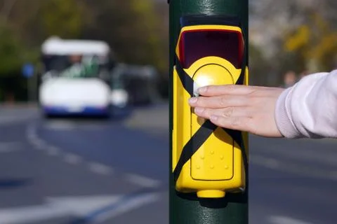 Turned off traffic light button for crossing the roadway with hand. Crossed p Stock Photos