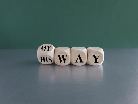 Turned a wooden cube and changes the expression his way to my way. Stock Photos