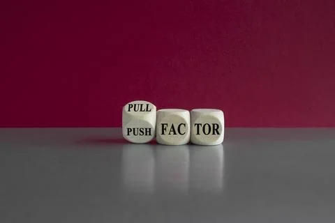 Turned wooden cube and changes the expression push factor to pull factor. Stock Photos