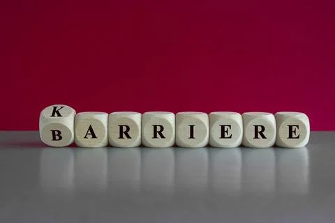 Turned a wooden cube and changes the German word "Barriere" to "Karriere" Foto stock