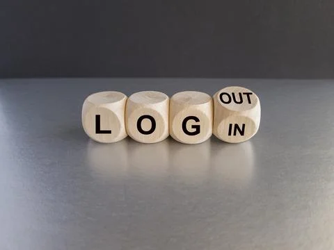 Turned wooden cube and changes the expression Login to Logout. Stock Photos