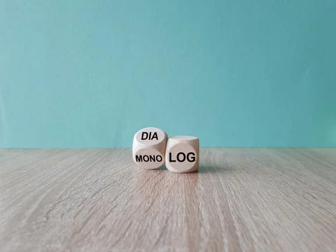 Turned a wooden cube and changes the German word Monolog  to Dialog Stock Photos