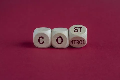 Turned a wooden cube and changes the concept word Cost to Control. Stock Photos