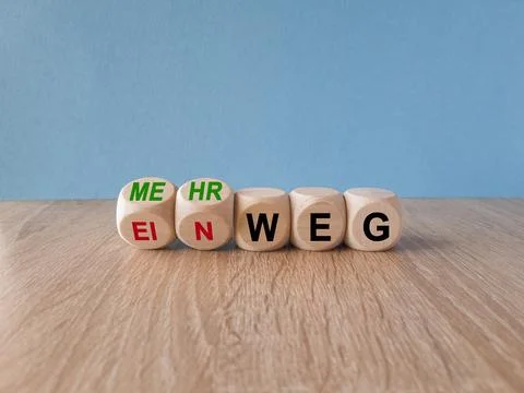 Turned wooden cubes and changes the German word Einweg (single use in English Stock Photos