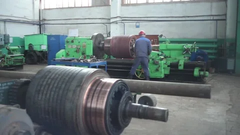 The Turner processes the workpiece on the machine Stock Footage 125547988