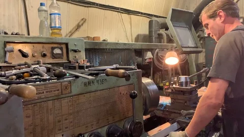 Turner on a turning and milling machine Stock-Footage 116170745