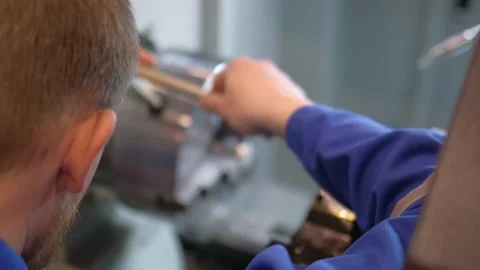 Turner working on high-tech machine. Factory man turner works for metal Stock Footage 153822849