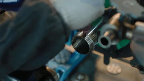 Turner is working on the machine. Welding metal. Worker works on a lathe. Turner Stock Footage 129708421