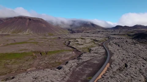 Turning aerial shot over dramatic Icelandic landscape: old lava fields. Video stock 167298711
