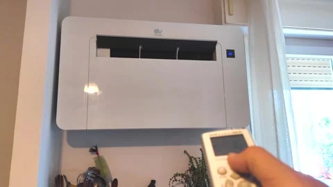 Turning off the air conditioner with the remote control unit Stock Footage 280051270