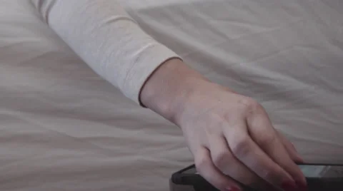 Turning off alarm clock Stock Footage 58415454