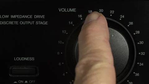 Turning up and down the volume control on a vintage stereo system Stock Footage 218986740