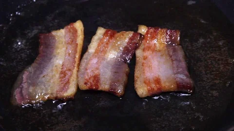 Turning And Frying Delicious Slice Of Bacon Stock Footage 88901161