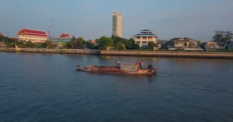 Turning around boat on a river with two men working early in the morning Video stock 108573775