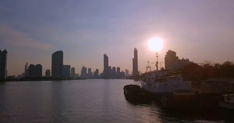 Turning around ship at harbour dock in Asia on a river with background view Stock Footage 108644638