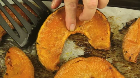 Turning Baked Pumpkin With Spatula Stock Footage 43686727
