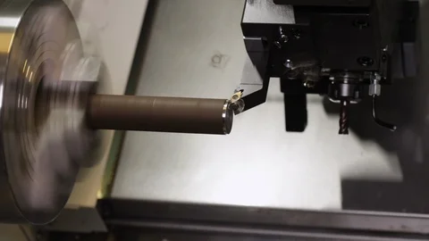 Turning bench lathe machine milling a metal rod - closeup Video stock 126021594