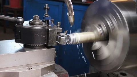 Turning bench lathe machine working . Cooling liquid flow and splash. Video stock 140721834